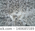 Aerial View of Snow Covered Forest with Clearing in Winter 140685589