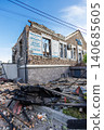 Bila Tserkva Kyiv region Ukraine - 09.06.2025 Corner view of destroyed brick medical clinic building with shattered windows collapsed roof structure and piles of burnt debris on street after explosion 140685605