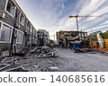 Bila Tserkva, Kyiv region, Ukraine - 09.06.2025: Wide angle view of destroyed city street with severely damaged buildings charred walls construction crane and metal debris after explosion 140685616