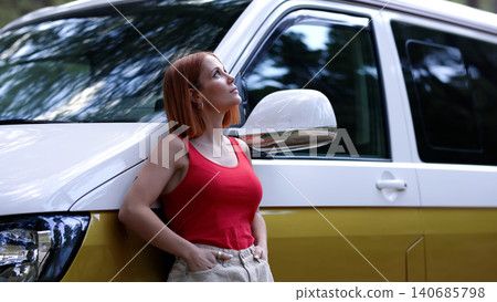 Woman enjoying freedom by camper van in nature Woman enjoying freedom by camper van in nature 140685798