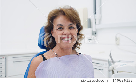 Senior woman smiling in dental clinic chair Senior woman smiling in dental clinic chair 140686135