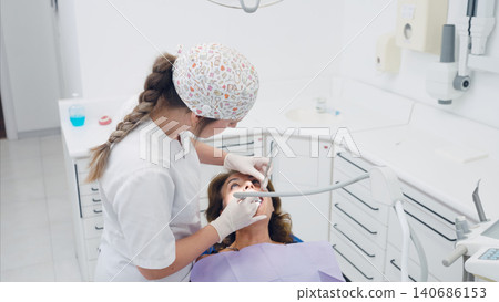 Dentist examining patient's teeth in clinic Dentist examining patient's teeth in clinic 140686153