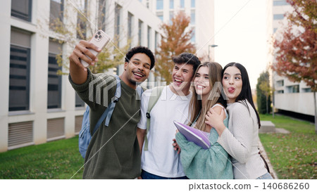Happy students taking selfie on university campus Happy students taking selfie on university campus 140686260