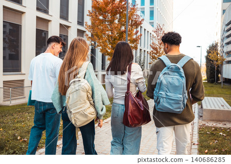 Students walking on campus path in autumn Students walking on campus path in autumn 140686285