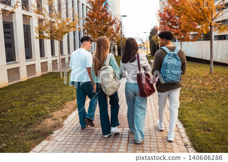 Diverse students walking campus during autumn 140686286