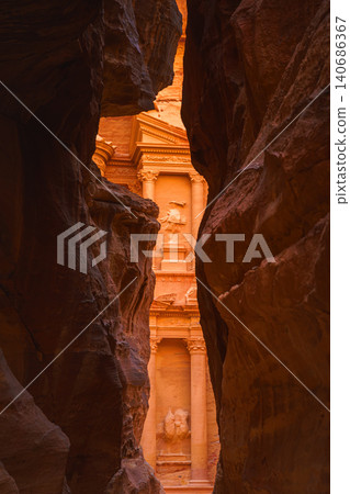 Petra, Wadi Musa, Jordan - Mar 06 2023, view of Al-Khazneh tomb from Siq Gorge, symbol of the city of Petra, Wadi Musa, Jordan Petra, Wadi Musa, Jordan - Mar 06 2023, view of Al-Khazneh tomb from Siq Gorge, symbol of the city of Petra, Wadi Musa, Jordan 140686367