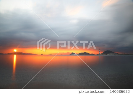 Seascape at sunshine. Lighthouse and sailings on the coast. Seaside town of Turgutreis and spectacular sunshine. Long Exposure shoot. Seascape at sunshine. Lighthouse and sailings on the coast. Seaside town of Turgutreis and spectacular sunshine. Long Exposure shoot. 140686623