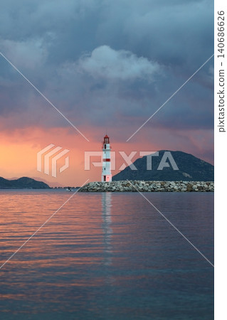Seascape at sunshine. Lighthouse and sailings on the coast. Seaside town of Turgutreis and spectacular sunshine 140686626