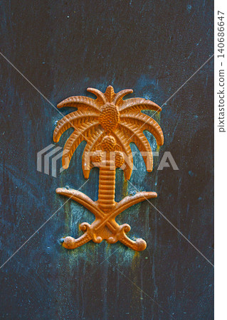 A close view of golden emblem of Saudi Arabia printed on metal, Jeddah, Saudi Arabia A close view of golden emblem of Saudi Arabia printed on metal, Jeddah, Saudi Arabia 140686647