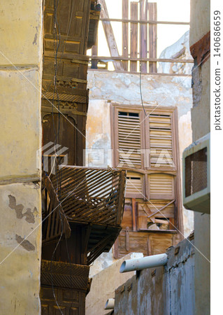 Jeddah, Saudi Arabia, a view of narrow passage between houses, alley in the old city of Jeddah Jeddah, Saudi Arabia, a view of narrow passage between houses, alley in the old city of Jeddah 140686659
