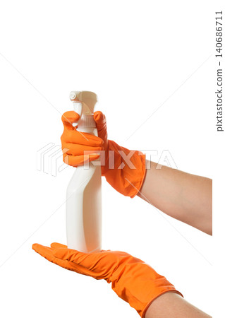 a person in orange gloves holding a trigger bottle on the palm a person in orange gloves holding a trigger bottle on the palm 140686711