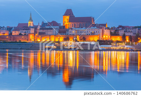 Historic Old Town Skyline Reflected in Vistula River at Blue Hour in Torun Poland 140686762