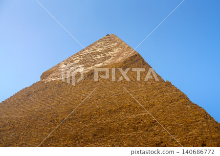 Giza, Egypt, a close up, bottom up view of top of the Khafren pyramid, at daytime Giza, Egypt, a close up, bottom up view of top of the Khafren pyramid, at daytime 140686772