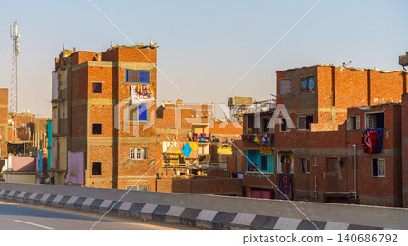 Cairo, Egypt - Mar 11 2023, panoramic view of the slum while driving on the highway, at daytime, Cairo, Egypt Cairo, Egypt - Mar 11 2023, panoramic view of the slum while driving on the highway, at daytime, Cairo, Egypt 140686792