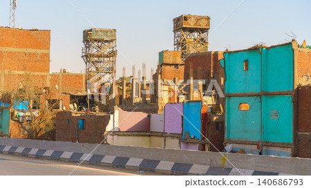 Cairo, Egypt - Mar 11 2023, panoramic view of the slum while driving on the highway, at daytime, Cairo, Egypt Cairo, Egypt - Mar 11 2023, panoramic view of the slum while driving on the highway, at daytime, Cairo, Egypt 140686793