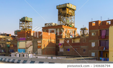 Cairo, Egypt - Mar 11 2023, panoramic view of the slum while driving on the highway, at daytime, Cairo, Egypt 140686794