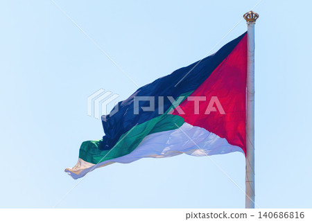 Aqaba, Jordan, a close up view, the flag of the Arab revolt are fluttering in the wind, at daytime Aqaba, Jordan, a close up view, the flag of the Arab revolt are fluttering in the wind, at daytime 140686816