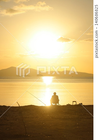 Tourists on holiday in the famous resort town of Bodrum spend time fishing at sunset. Tourists on holiday in the famous resort town of Bodrum spend time fishing at sunset. 140686825
