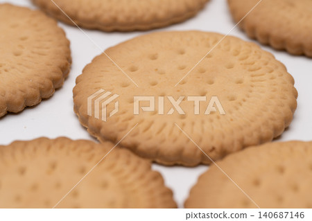 The texture of the cookie is represented by a light beige color to depict food. The texture of the cookie is represented by a light beige color to depict food. 140687146