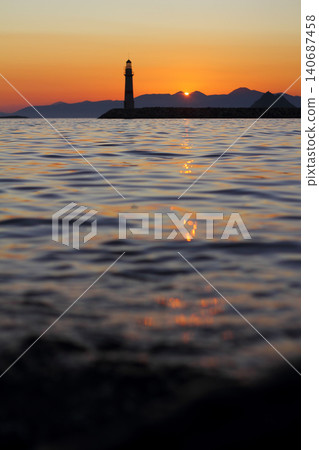 Seascape at sunshine. Lighthouse and sailings on the coast. Seaside town of Turgutreis and spectacular sunshine Seascape at sunshine. Lighthouse and sailings on the coast. Seaside town of Turgutreis and spectacular sunshine 140687458