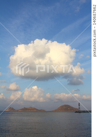 Seascape at sunshine. Lighthouse and sailings on the coast. Seaside town of Turgutreis and spectacular sunshine Seascape at sunshine. Lighthouse and sailings on the coast. Seaside town of Turgutreis and spectacular sunshine 140687662