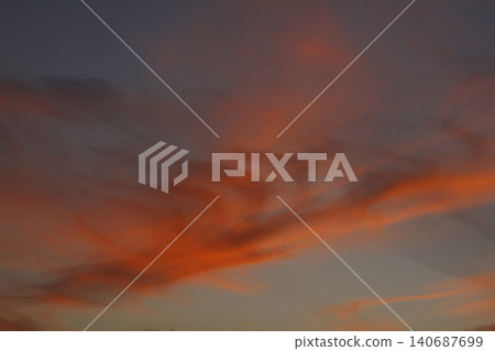 Dramatic red and orange sky and clouds abstract background. Red-orange clouds on sunset sky. Warm weather background. Art picture of sky at dusk Dramatic red and orange sky and clouds abstract background. Red-orange clouds on sunset sky. Warm weather background. Art picture of sky at dusk 140687699