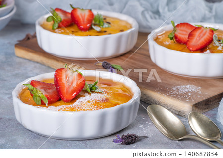 Creme brulee - traditional french vanilla cream dessert with caramelised sugar on top. Leite creme, portuguese desert. Creme brulee - traditional french vanilla cream dessert with caramelised sugar on top. Leite creme, portuguese desert. 140687834