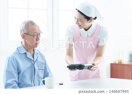 Helpers who serve meals to the elderly Helpers who serve meals to the elderly 140687995