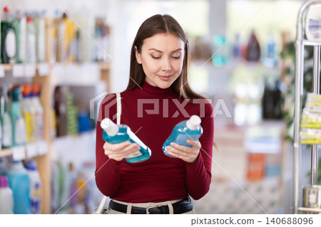 Young woman choosing mouthwash in store Young woman choosing mouthwash in store 140688096