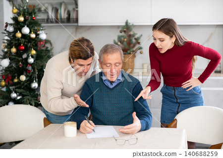 Couple discussing inheritance with older man Couple discussing inheritance with older man 140688259