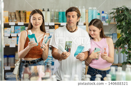 Family choose oral care products at pharmacy Family choose oral care products at pharmacy 140688321