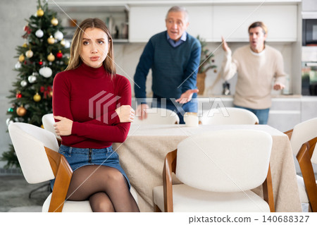 Family quarrel at Christmas - sad woman does not want to talk to father and husband Family quarrel at Christmas - sad woman does not want to talk to father and husband 140688327