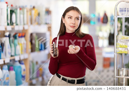Young woman choosing perfume 140688431