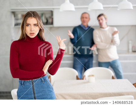 Men quarreling with girl Men quarreling with girl 140688528