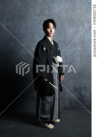 A man in a hakama with a crest A man in a hakama with a crest 140688738