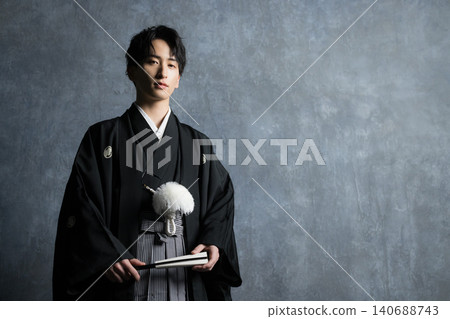 A man in a hakama with a crest A man in a hakama with a crest 140688743