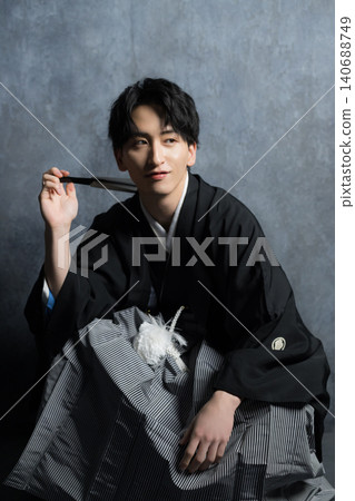 A man in a hakama with a crest A man in a hakama with a crest 140688749