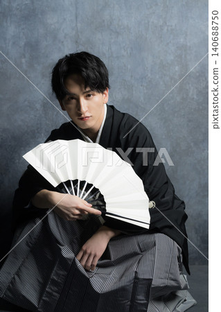 A man in a hakama with a crest A man in a hakama with a crest 140688750
