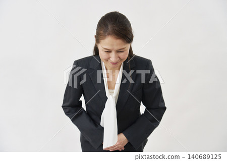 A woman bowing on a white background A woman bowing on a white background 140689125