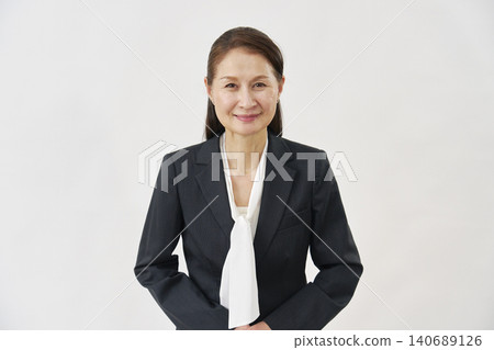 A woman bowing on a white background A woman bowing on a white background 140689126