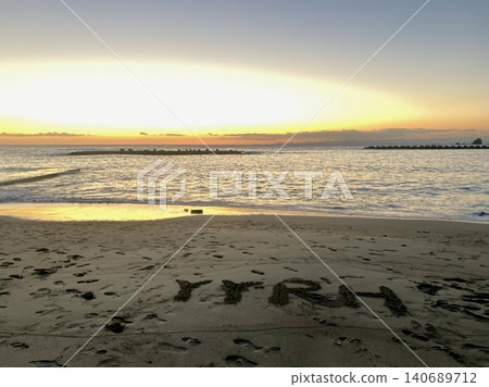 Messages drawn on the beach and sand at sunset Messages drawn on the beach and sand at sunset 140689712