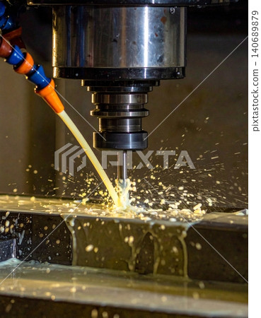 CNC milling machine processing on steel with cooling, coolant milk in the metal CNC milling machine processing on steel with cooling, coolant milk in the metal 140689879