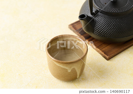 Plain hot water boiled in an iron kettle Plain hot water boiled in an iron kettle 140690117