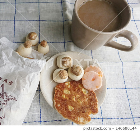 A peaceful scene during teatime. Enjoying a careful and natural lifestyle with sweets and coffee. A peaceful scene during teatime. Enjoying a careful and natural lifestyle with sweets and coffee. 140690144