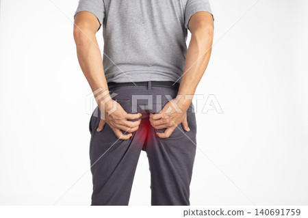 Hemorrhoidal pain, man with hemorrhoids on white background. Hemorrhoidal pain, man with hemorrhoids on white background. 140691759