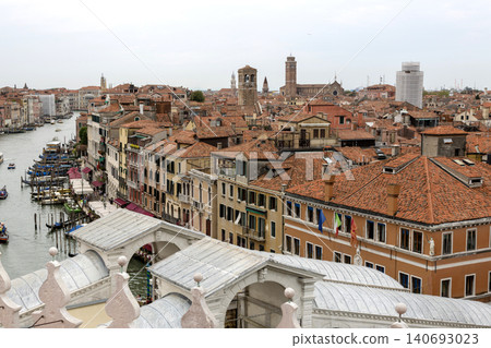 Venice, Italy - August 22, 2019: View of Venice from the roof of a house. Venice, Italy - August 22, 2019: View of Venice from the roof of a house. 140693023