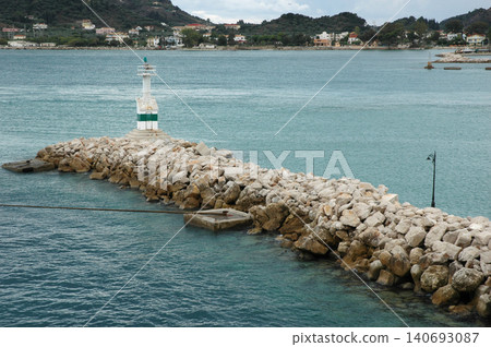 Small Lighthouse on Stone Breakwater in Zakynthos Harbor Small Lighthouse on Stone Breakwater in Zakynthos Harbor 140693087