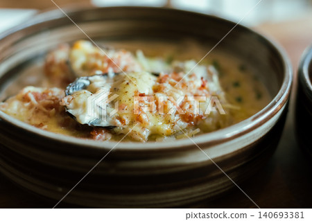 baked mussels with cheese on wooden table baked mussels with cheese on wooden table 140693381