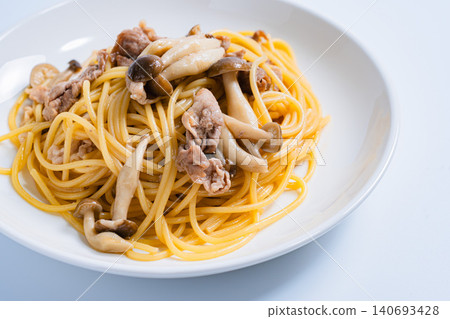 Japanese-style pasta with pork slices and mushrooms Japanese-style pasta with pork slices and mushrooms 140693428