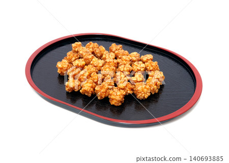 Sugar-coated rice crackers, caramel flavored, arare [white background, cutout] 140693885